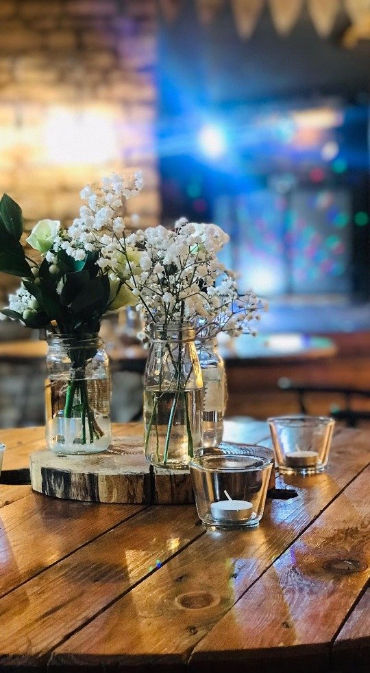 Floral table arrangement for wedding party at the Duke of Wellington in Stanwick Floral table arrangement for wedding party at the Duke of Wellington in Stanwick